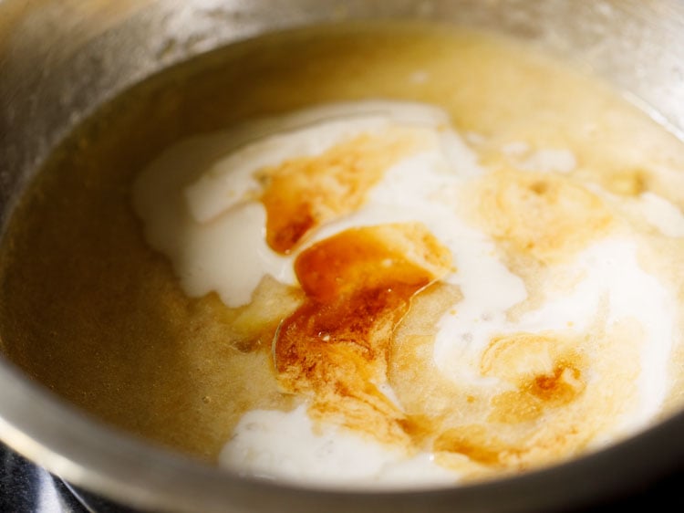 oil, almond milk and vanilla extract added to mashed bananas. 