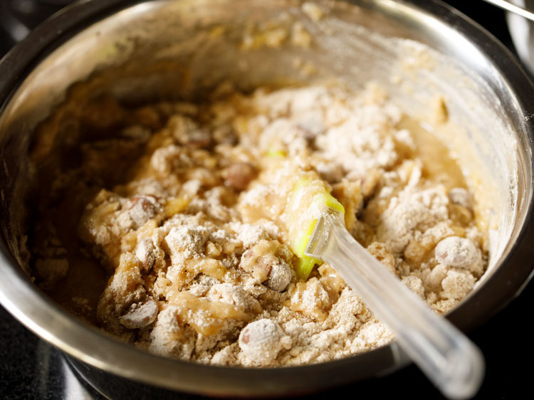 folding dry ingredient in wet ingredients. 