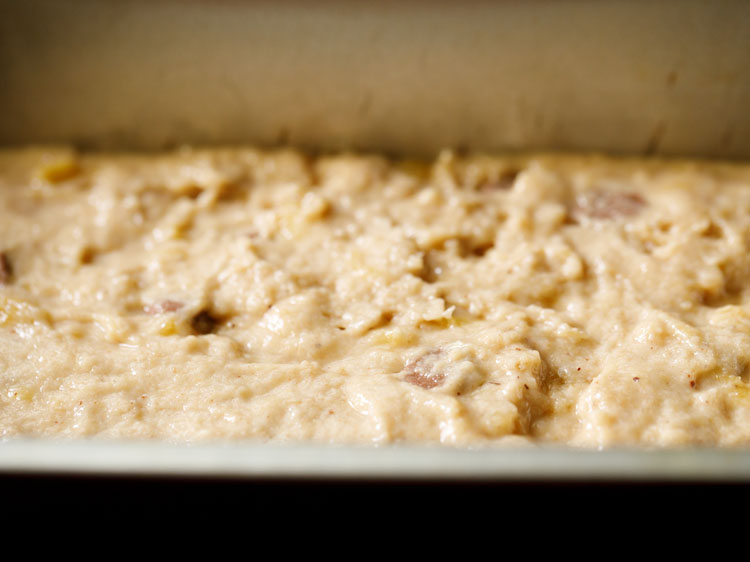 prepared bread batter poured in the greased pan.