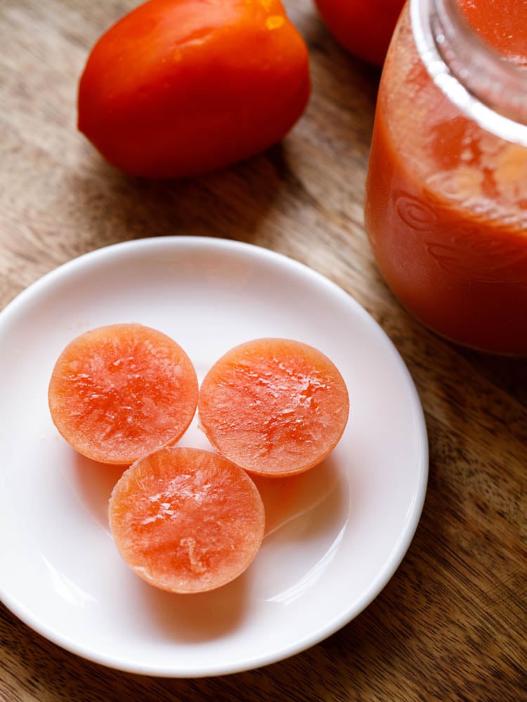 frozen cubes of tomato puree on a white plate.