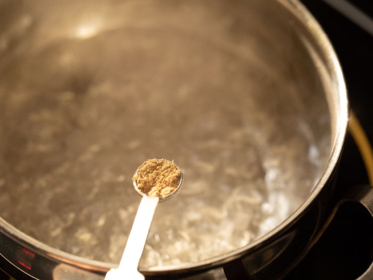 adding dry ginger powder when the water comes to a boil.