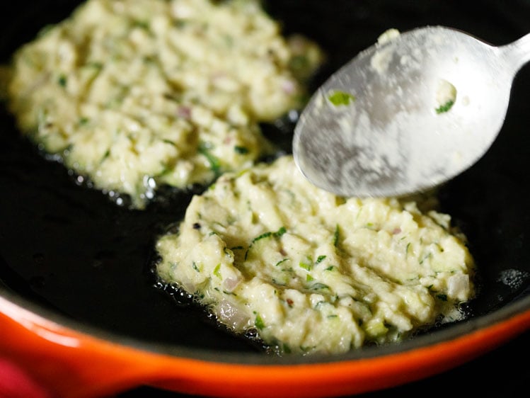 spreading & flattening the batter a bit with the spoon.