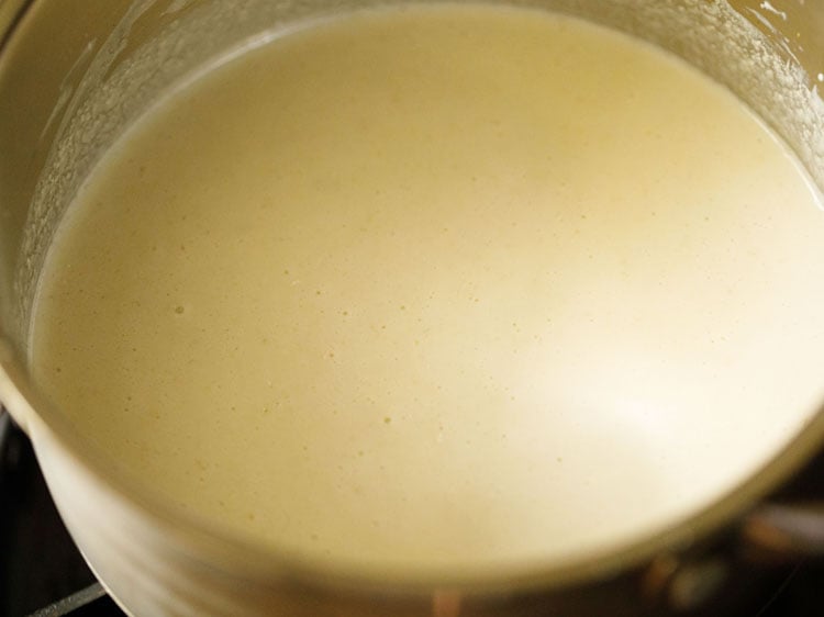 buttermilk yogurt sauce in a silver saucepan over heat