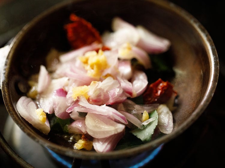 diced shallots and ginger added to tadka pan