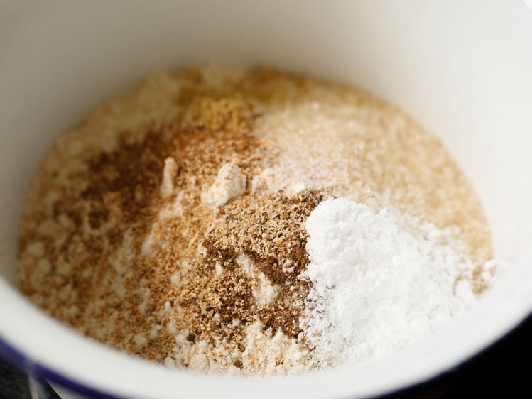 dry ingredients taken in a white mixing bowl.