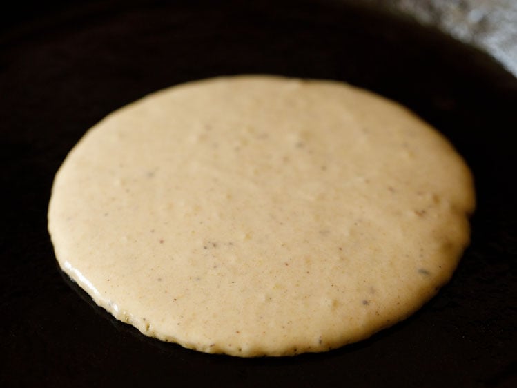 batter poured on a cast iron skillet.