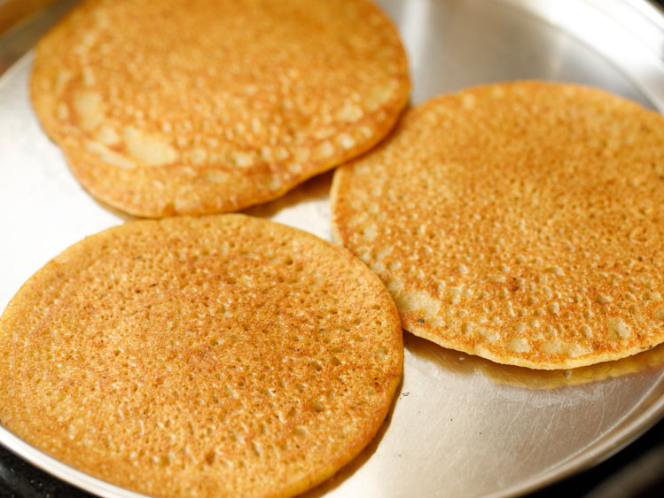 pancakes made and kept on a steel plate.