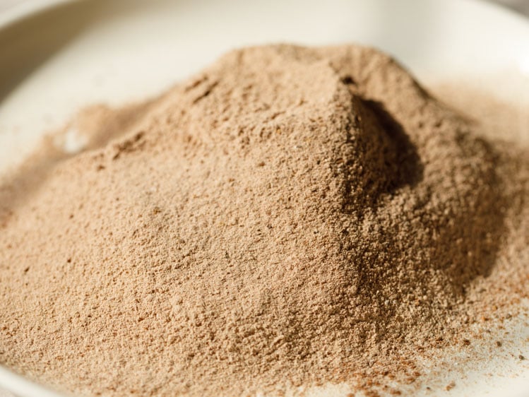 sifted dry mixture of flour and spice powders on a plate