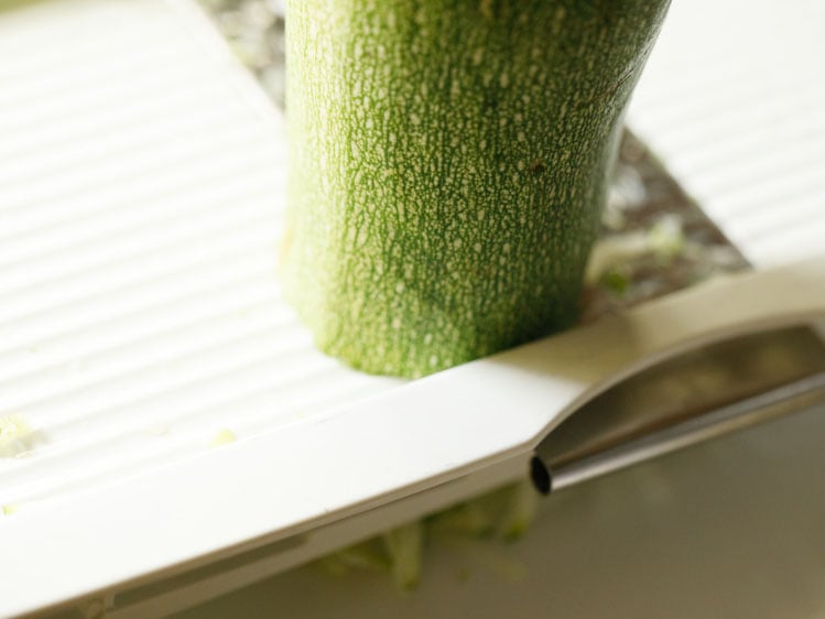 zucchini being grated