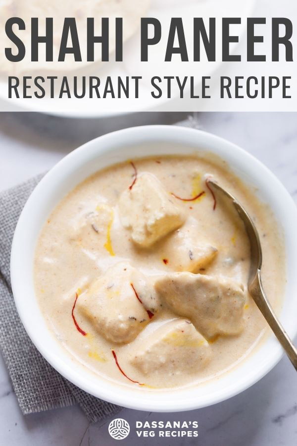 shahi paneer topped with some saffron strands and served in a white bowl on a white marble surface
