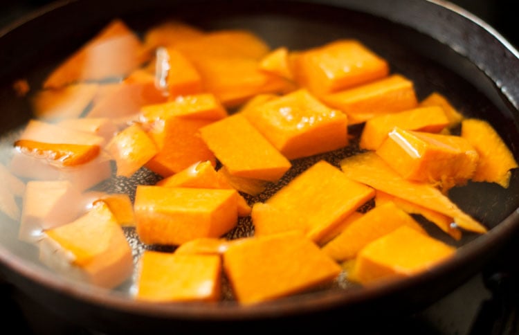 pumpkin cubes in a stockpot with water