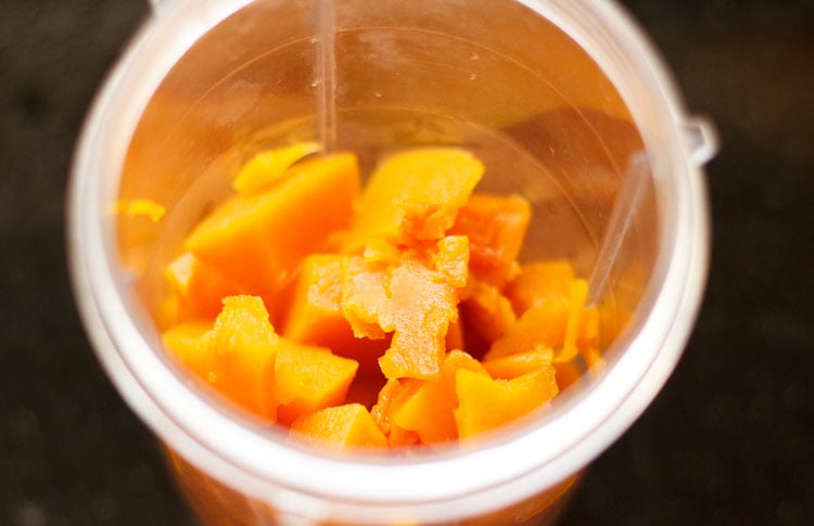 cooled and cooked pumpkin cubes in a blender jar