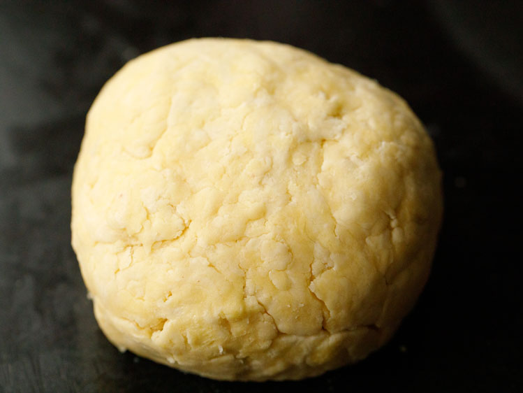 pie crust dough pressed together into a small ball shape to rest