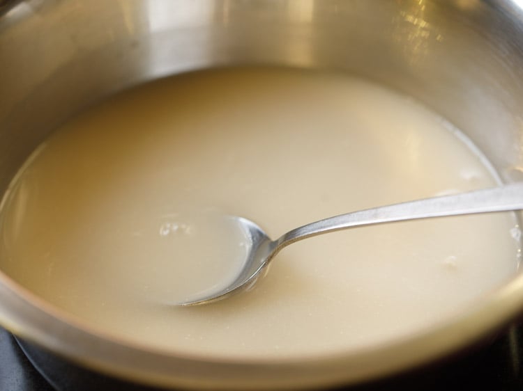 warm water added and mixed with a steel spoon