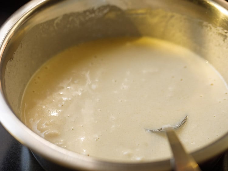 flour, olive oil and salt mixed with the yeast mixture with a steel spoon