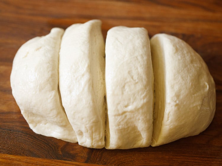 pizza dough cut and divided in four parts