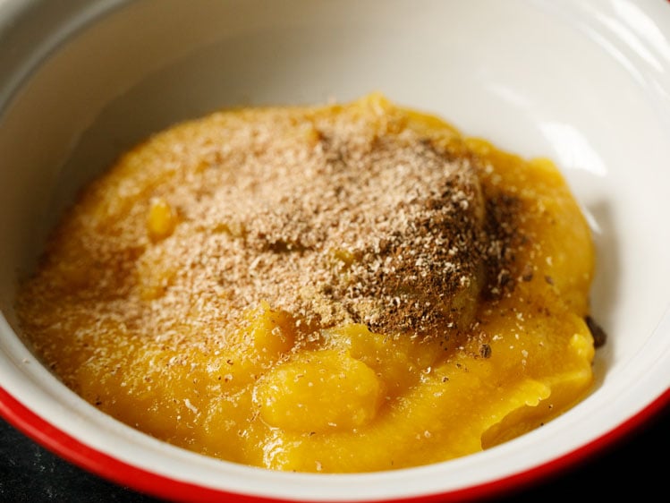 pumpkin purée in a white bowl with pumpkin pie spices