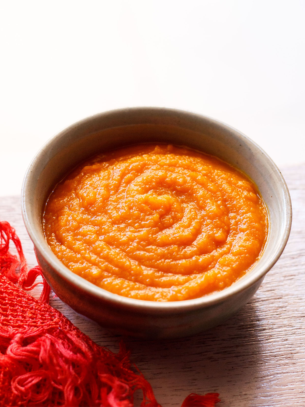 homemade pumpkin purée in a white earthenware bowl