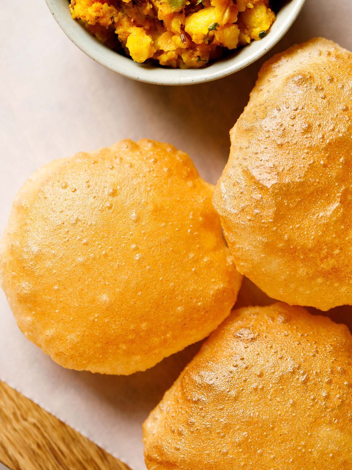 poori placed on parchment paper