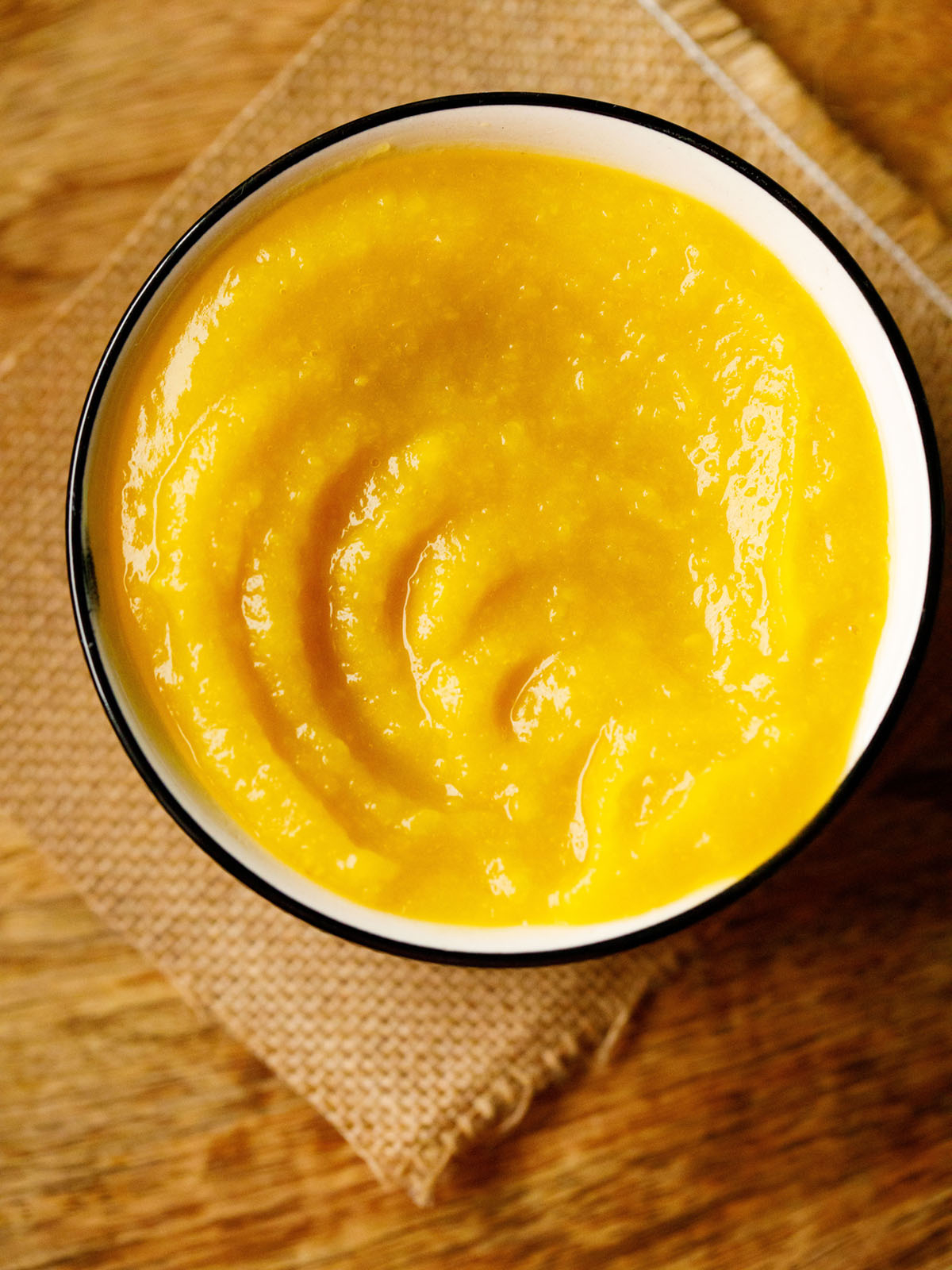 homemade pumpkin purée in a white bowl with a black rim