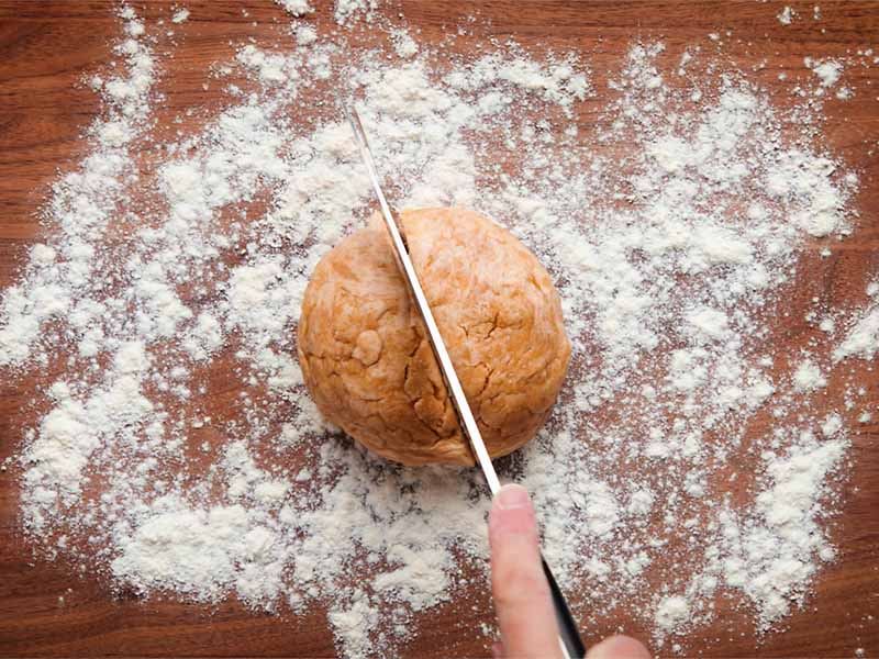 dough being sliced in half