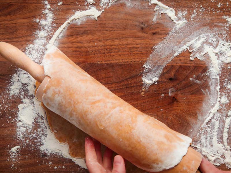 dough lifted on the rolling pin