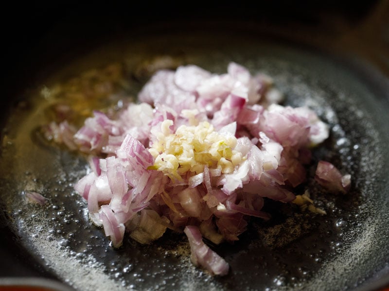 minced garlic and onions added to skillet with melted butter