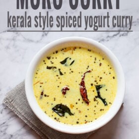 kerala moru curry in a white bowl on a white marble table
