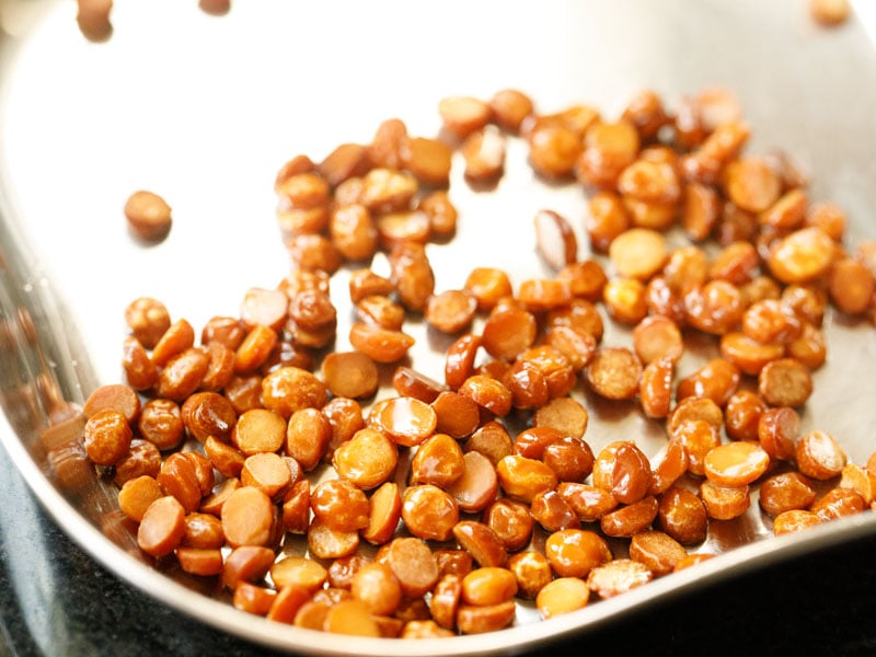 chana dal set aside in a steel plate to make groundnut chutney