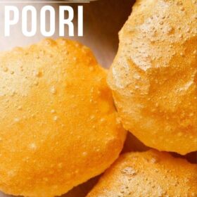 golden fried poori placed on white parchment paper