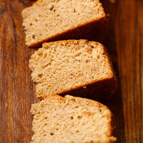 top view of apple cake slices on a brown wooden board