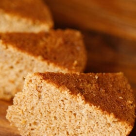 45 degree angle shot of triangular apple cake wedges showing the soft crumb