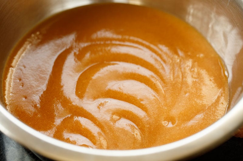 closeup shot of apple puree in a steel mixing bowl