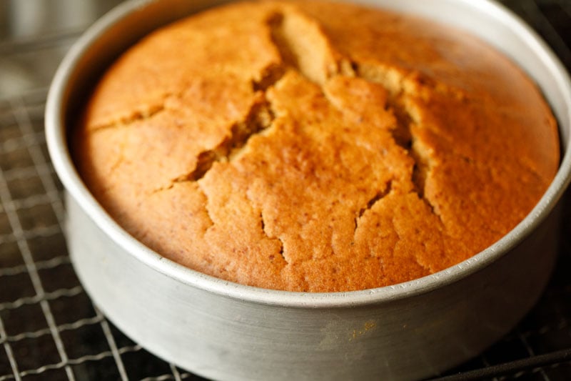 top shot of finished vegan apple cake on cooling rack