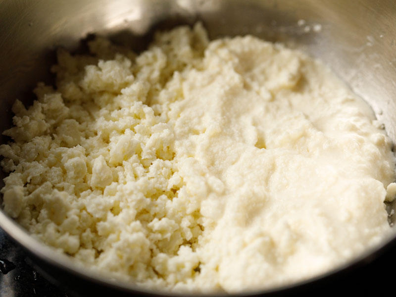 ricotta and heavy cream in a mixing bowl
