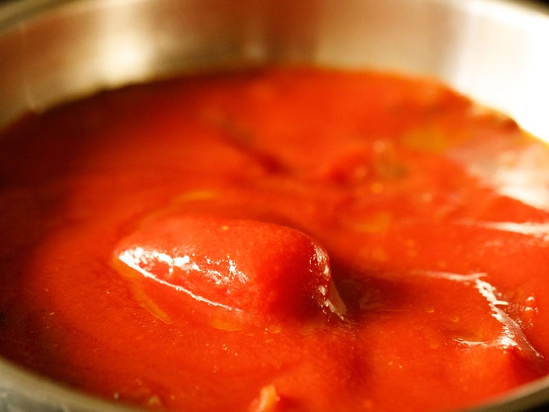 canned tomatoes and their sauce added to the sauté pan with the mushrooms, onions and garlic