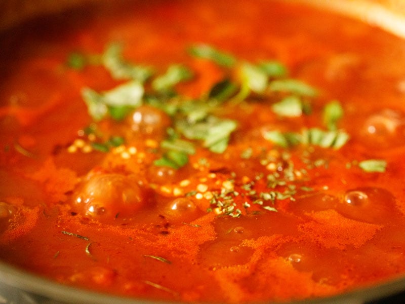 basil, Italian seasoning and red pepper flakes added to tomato sauce