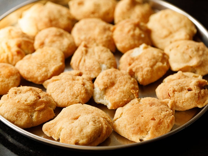 tray of dumplings or vada on a steel plate