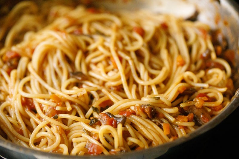 spaghetti tossed and mixed with mushroom bolognese sauce