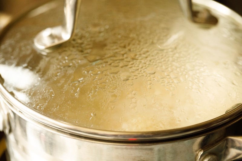 lid on stockpot with Thai soup