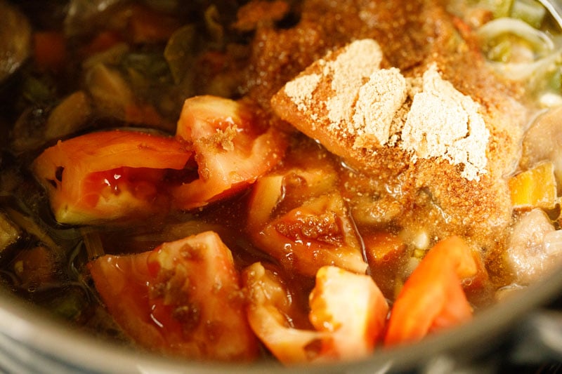 diced tomatoes and mushroom powder added to tom kha soup