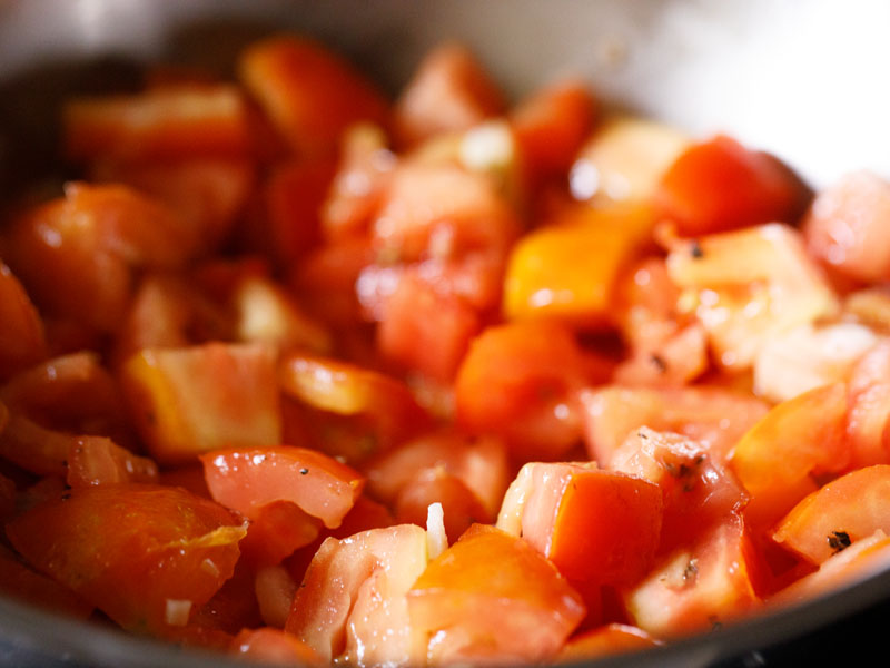 tomatoes, salt, pepper, scallion whites and garlic all stirred together to sauté