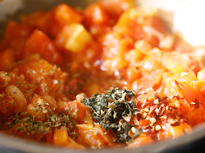 red pepper flakes, dried oregano and red wine added to tomato mixture