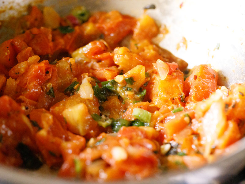 tomato pie mixture after adding fresh basil and scallion greens 