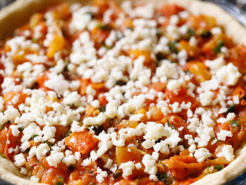 mozzarella atop tomato mixture in pie shell