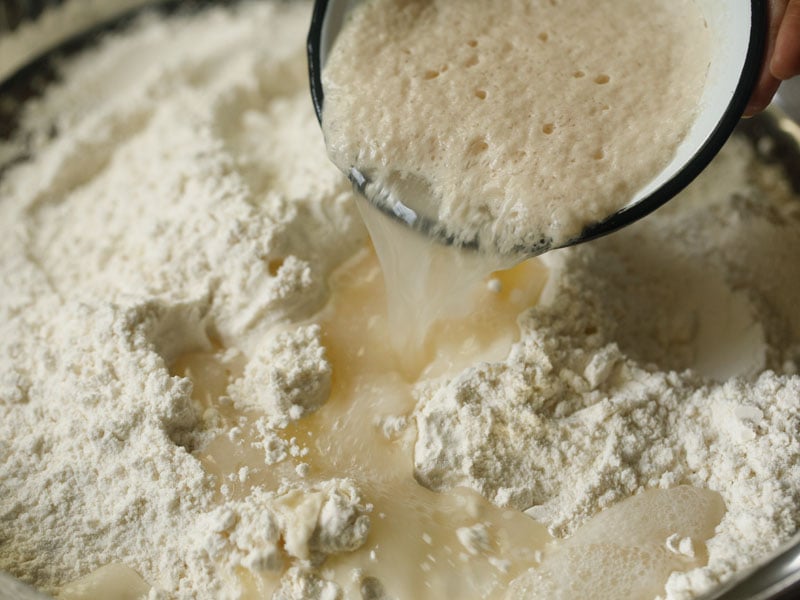 frothy yeast mixture being added