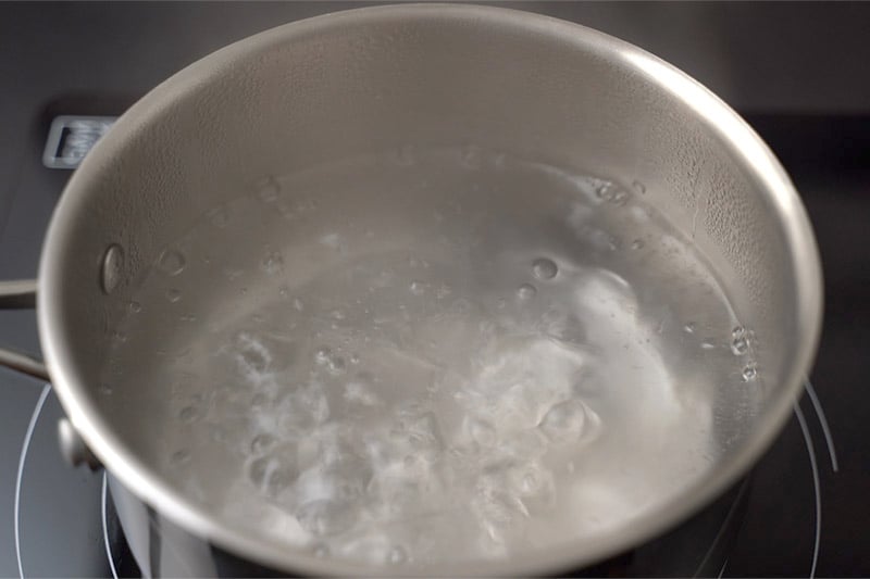 top shot of salt water boiling in pot