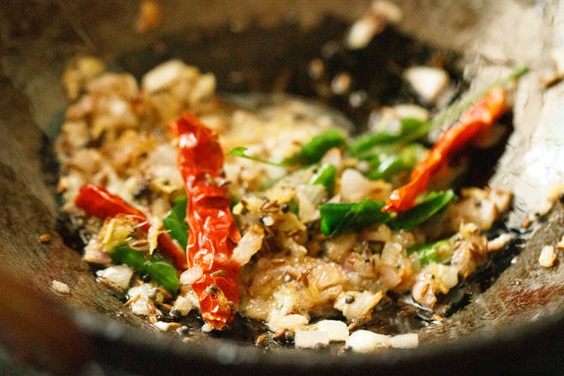 sautéing the spices and herbs