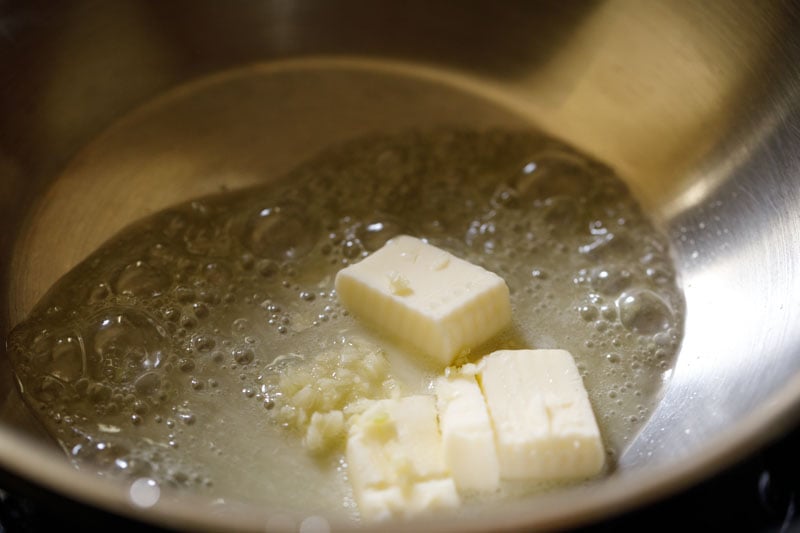 garlic and butter cubes in pan