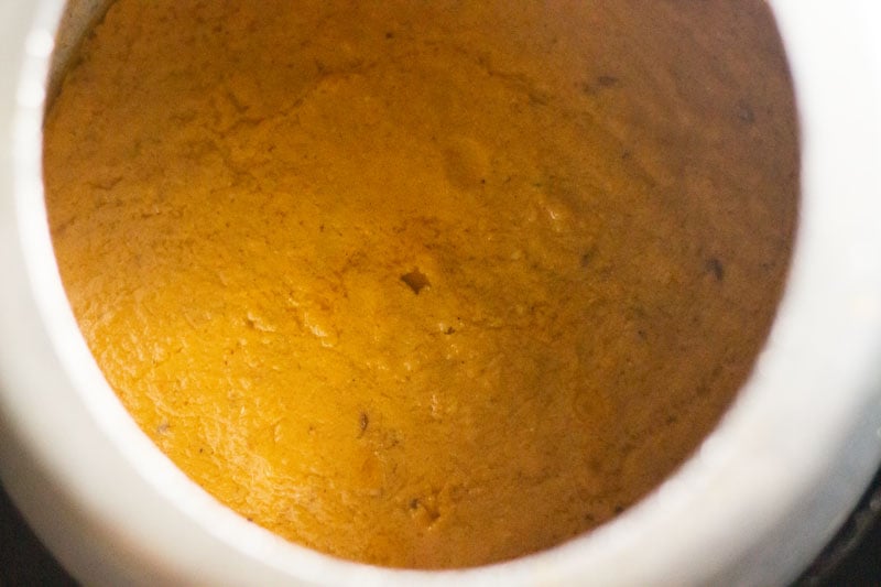 Top shot of masala paste in a pressure cooker